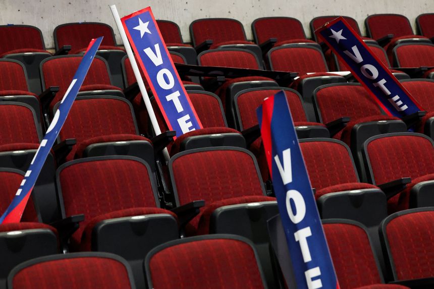 Vote signs lie on chairs after the end of Day 2 of the Democratic National Convention in Chicago, Illinois