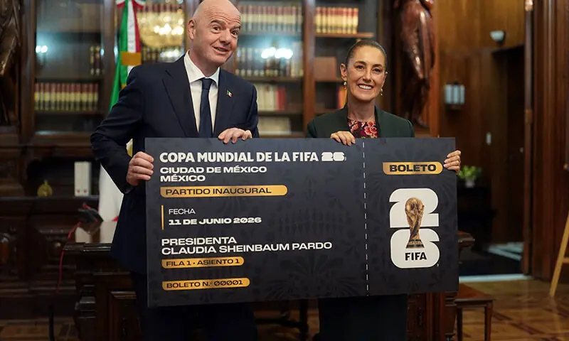 Mexican President Claudia Sheinbaum and FIFA president Gianni Infantino hold the FIFA World Cup trophy at the National Palace, in Mexico City, Mexico
