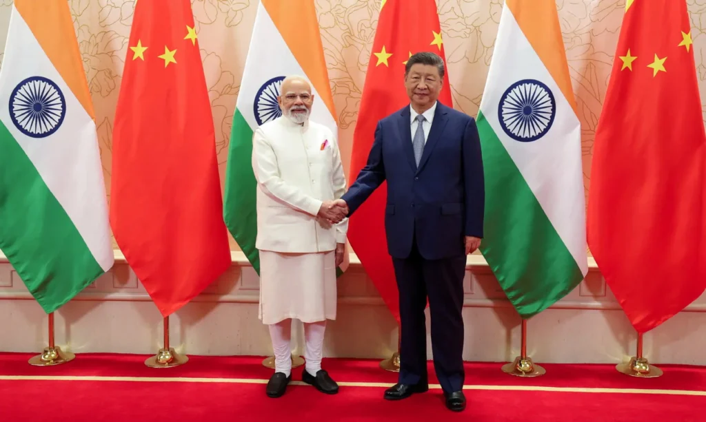 India’s Prime Minister Narendra Modi shakes hands with Chinese President Xi Jinping