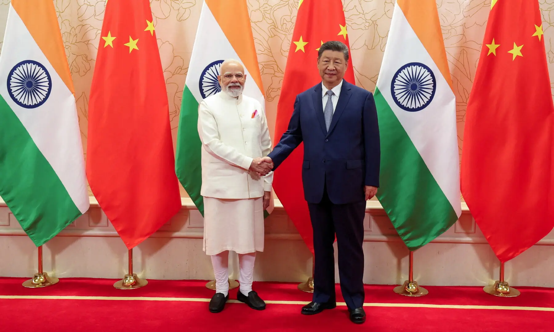 India’s Prime Minister Narendra Modi shakes hands with Chinese President Xi Jinping