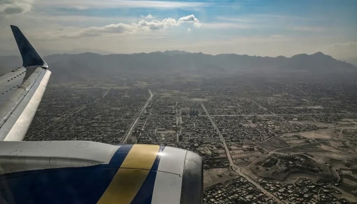 A view from inside a commercial plane flying over Kabul city in November 2021, after the Taliban takeover in August of that year