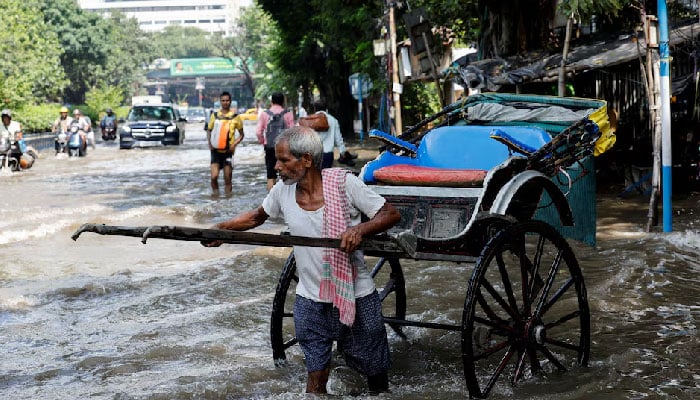 At least 12 dead as record rain floods India’s Kolkata